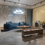 Luxury Teal Velvet Curved Sectional Sofa with Natural Wood Veneer Base & Branded Cushions